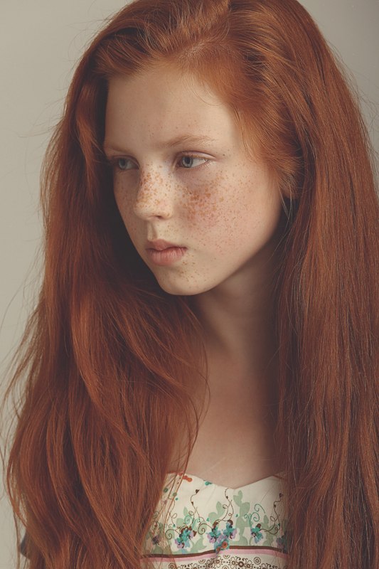 Girl with red hair freckles green eyes