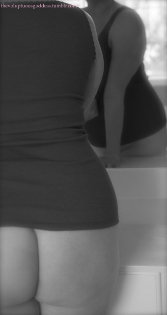 thevoluptuousgoddess:  Trying to wake up. Then, you. Checking out my ass out while I check myself out in the mirror. Smack it! Mmpf! Maybe I can be late for work…The Voluptuous  Goddess