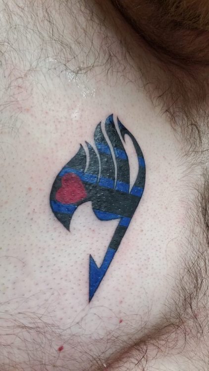 walkingtheline: Got something new. Leather variant of the Fairy Tail emblem. Accomplished two things I have wanted for a very long time, in the same tattoo. A sense of belonging in my own way. I love it. It’s clean as fuck. Fuck anyone else. … It’s