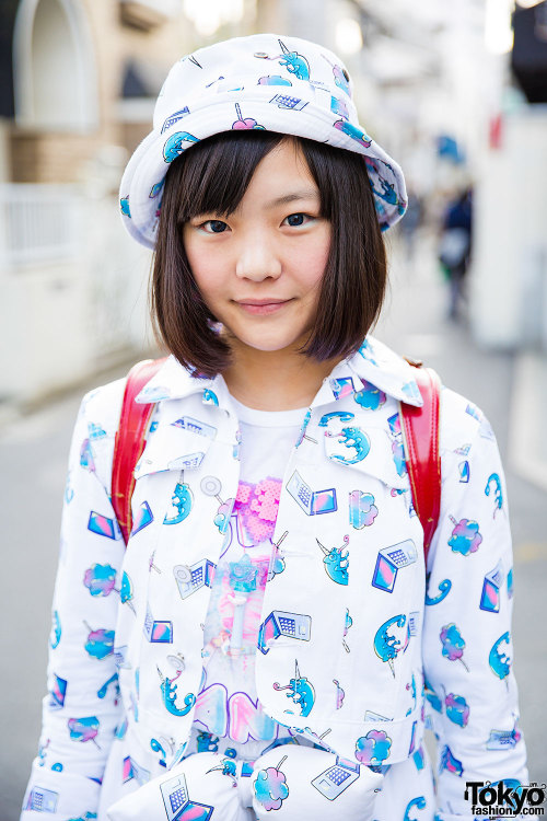 Aipanda and Tashu - both 17 years old - on the street in Harajuku wearing graphic outfits by Galaxxx