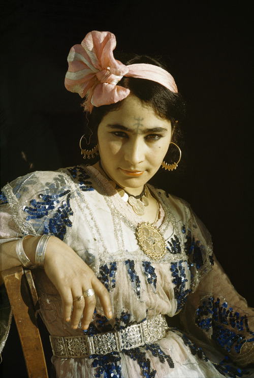 An Ouled Nail woman in Algeria wears a tattoo that is customary for dancers, 1949. Photograph by May