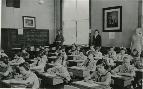 Children take a hearing test given by Works Progress Administration instructors in Holyoke, MA, 5/12