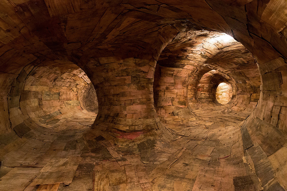 10 - Artist Henrique Oliveira Constructs a Cavernous Network of Repurposed Wood