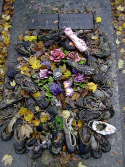 congenitaldisease:The grave of Marie Taglioni, a ballerina who pioneered the en pointe style of dance. Young dancers often leave their dancing shoes on her grave.