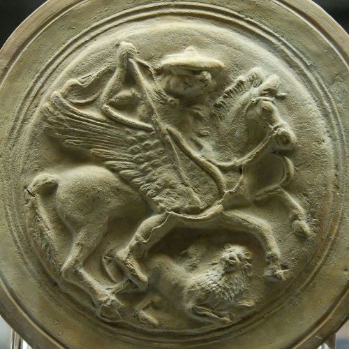 aucelo:Bellerophon and the Chimaera. Terracotta flask with moulded medallions, made in Apulia, ca. 3