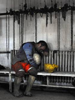  A miner waits for his friends in Manisa,