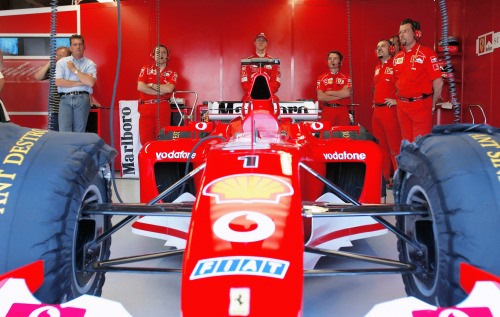 CANADA, 2002 — Michael Schumacher, the Ferrari F2002, and Ferrari technical director Ross Brawn in t