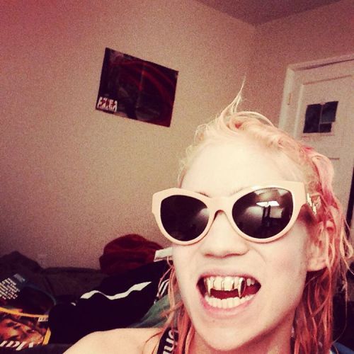 Grimes wearing custom fangs by Japanese dentist-turned-designer Fangophilia. We made a short movie a
