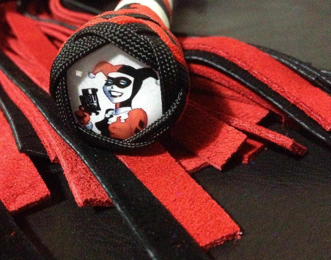 bdsmgeek:  edgeplay-co-uk:  Harley Quinn themed whip and flogger. Only one of each