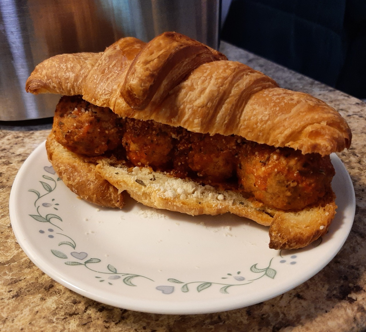 meatball sandwich on a buttery toasted croissant #food#sandwich#croissant#pastry#butter#olive oil#sea salt#tomato sauce#tomato puree#tomato#garlic#basil#parmesan#cheese#meatball#beef#pork#meat#spring#may