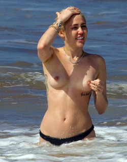 famous-nsfw-tub:  Miley Cyrus beach edition.