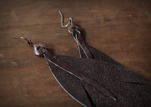 A pair of handmade leaf earrings, super light and crafted from a super soft and light up-cycled sued