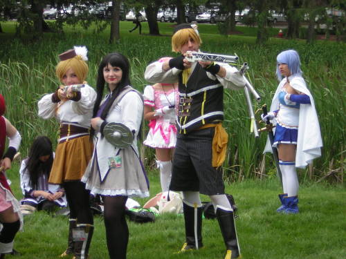 righthandminion:  Madoka Magica photoshoot at AnimeNEXT  Ahhh yay!  More pictures of us! The Sayaka farthest right that’s bent in an action pose is appledress, the Kyoko next to her is meeeee, and the tall Homura behind us is funkypriest.