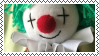 a stamp with a picture of a clown plushie