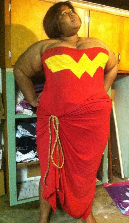 fatpeopleofcolor:  [Image Description: In the picture is a black woman wearing an original design she made based off of the character, Wonder Woman. The costume was made by her partner. The top is red with the Wonder Woman logo on it while the skirt is