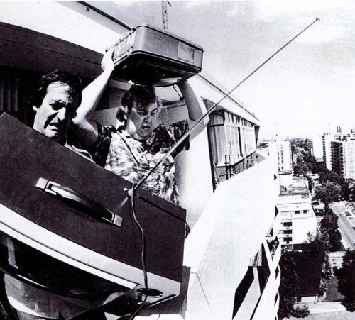 pbandjcomedy:    Joe Flaherty and John Candy preparing to throw TVs from a balcony for the opening credits to SCTV.  