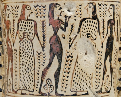Couples dance to the sound of the aulos (double flute).  Neck of a proto-Attic loutrophoros, at
