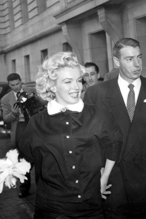 Marilyn Monroe and Joe DiMaggio on their wedding day in 1954. They split less than a year later.