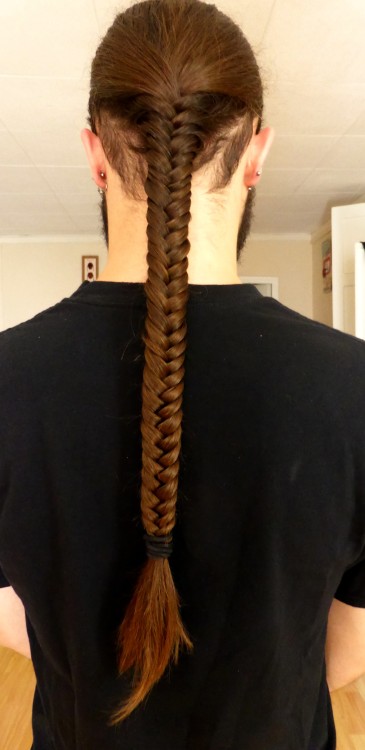 Submission from keepxlaughing: He grows his hair and I braid it. Looks great!