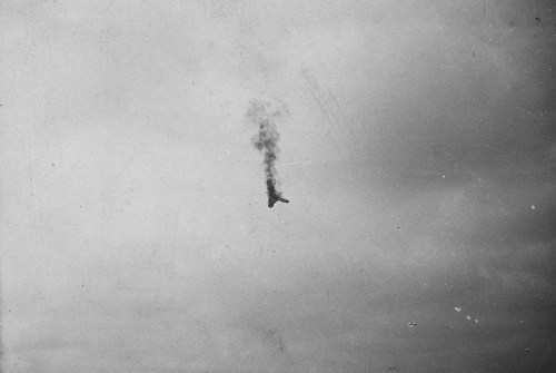 A German balloon being shot down (WW1).An aircraft falls from the sky in flames (WW1).