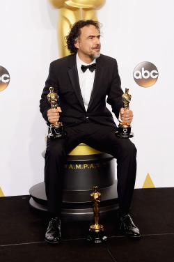 celebritiesofcolor:Director Alejandro Gonzalez Inarritu, winner of Best Original Screenplay, Best Director, and Best Motion Picture, for ‘Birdman’ poses in the press room during the 87th Annual Academy Awards at Loews Hollywood Hotel on February 22,