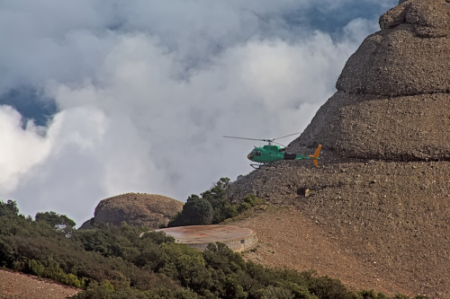 Helicopter over Montserrat mountains