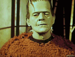 nitratediva:  Boris Karloff, wearing his Frankenstein’s monster makeup, goofs off in some color home movie footage from the set of Son of Frankenstein (1939). 