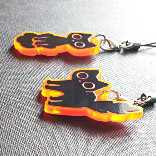 starpatches:Black cat charms on fluorescent orange acrylic!http://starpatches.tictail.com/product/bl