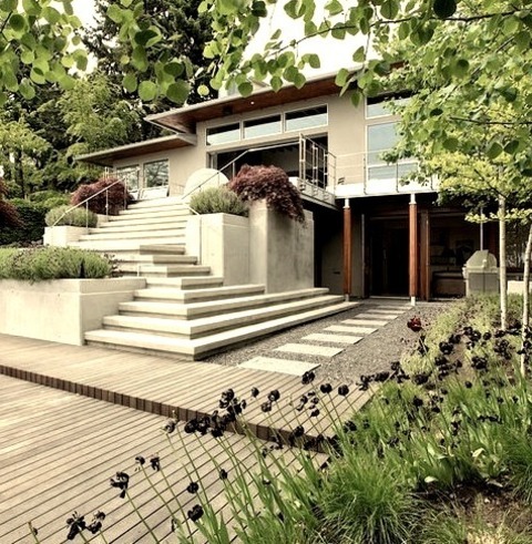 Concrete ExteriorLarge Two-story Gray Minimalist Home Exterior Image