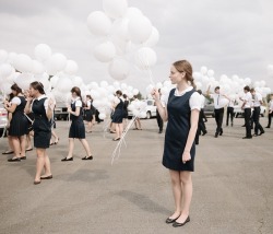global-musings:    An Ossetian graduate from the town of Beslan prepares to release balloons in honor of the 385 people killed in the 2004 siege   Location: North Ossetia-Alania, Russian Federation Photographer: Diana Markosian 