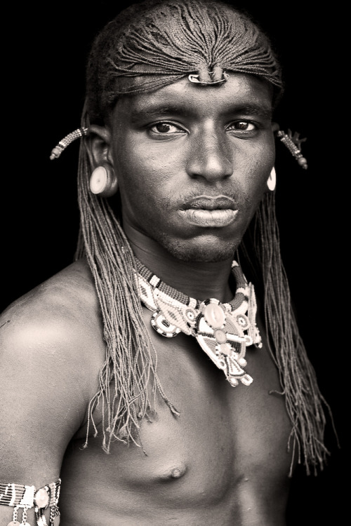 Samburu warriors11. Samburu warrior casts ballot at polling station in Nkirish, KenyaMen wear a clot