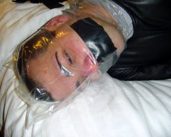 lovingair:  bondagejock:  Breathplay bagging.   Sub: Bondagejock  Dom: LBLeather    Not truly knowing how far he will let it go. 