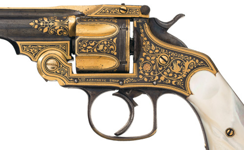 peashooter85:A gold damascened Spanish copy of a Smith and Wesson revolver with pearl grips. Produce
