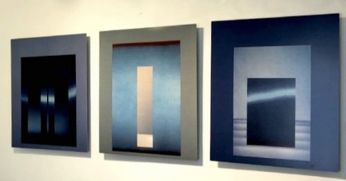 Victoria Lowe’s “Sanctuary Series” prints on aluminum are lit up from behind with blue light. These 