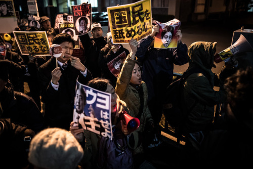 Protesters shout slogans during a rally against Japan’s Prime Minister Shinzo Abe’s secu