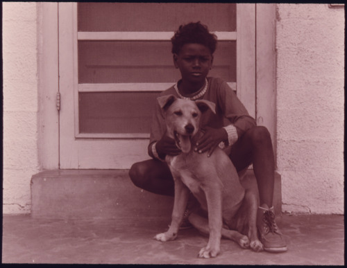 Boy with his dog in Galveston, Texas, 1973. [Credit : Danny Lyon]