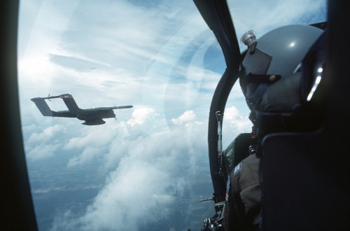 stalker6delta:titanium-rain:As seen from the aircraft’s cockpit, an OV-10A Bronco aircraft flies beh