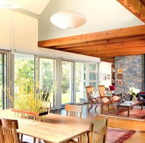 Great Room - Dining RoomWith Green Walls, A Wood Stove, And A Stone Fireplace, This Medium-sized, Trendy
