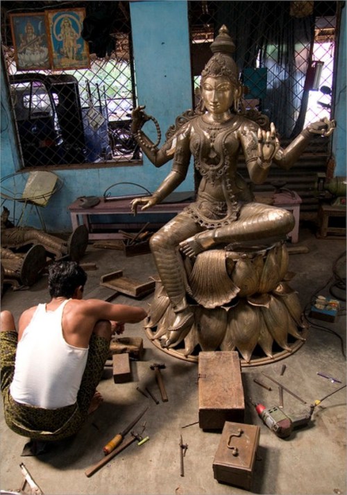 Sthapati (deity sculptor) and Saraswati statue. Swamimalai, Tamil Nadu