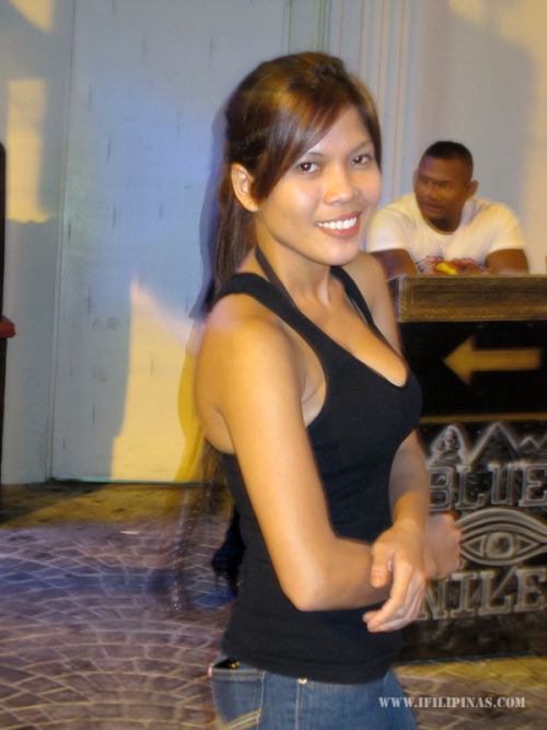 asia-cute: The doorgirl at Blue Nile Bar. Wanna come in for more smiles? Sure.