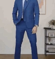A gif of a man checking his watch in a blue suit. You can see everything but the man's shoes and face