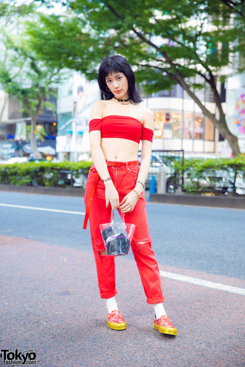 Weni on the street in Harajuku wearing a red outfit with Vans x Opening Ceremony Qi Pao sneakers, a 