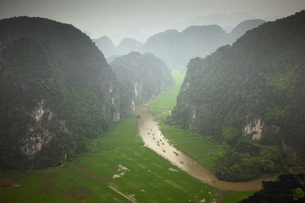 Daily Travel Photo: Tam Coc, Ninh Binh, Vietnam
Photograph by Dennis Walton, Getty Images
Boaters paddle their way down a river in Tam Coc, Ninh Binh, Vietnam, at the heart of the Trang An Landscape Complex. The area, designated as Vietnam’s newest...