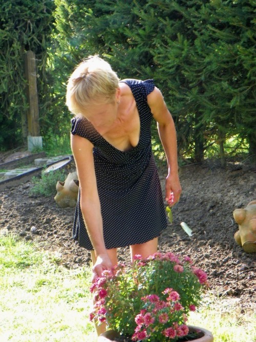 iluvallwoman:My wife at garden and sunbathing…