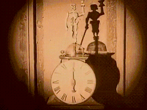 blondebrainpower:Skeleton clock striking midnight in Nosferatu 1922
