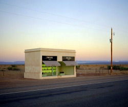 tiit:  The instillation “Prada Marfa” by Elmgreen and Dragset is located along US 90 in Valentine, Texas. It cost ๠,000 to be constructed and will never be repaired so that it can degrade back into the preexisting landscape.  