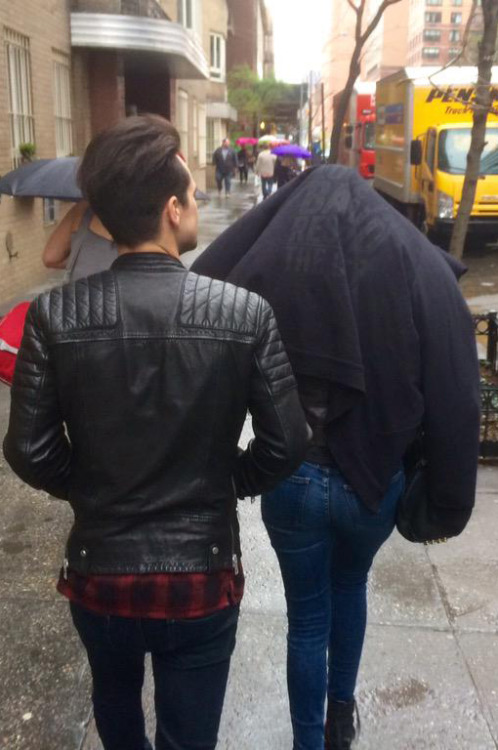 marchingclocks:  It’s raining, people have umbrellas, Sarah put a whole jacket over herself…and then there’s Brendon Urie with no rain gear, and his hair looks flawless, untouched by the rain. The laws of science don’t apply to him