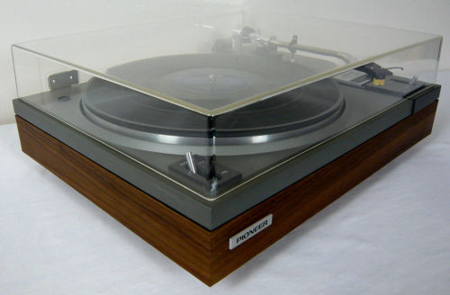 Pioneer PL-115 | Auto Return Belt DriveTurntable. Reconditioned and serviced. Semi automatic. Original vinyl removed and replaced with real wood walnut veneer. Mechanism cleaned and lubricated. The dust cover has been buffed and polished. Sure Hi Track