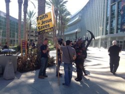 necroticnymph:  briansandstorm:  That awkward moment when Diablo shows up to your religious protest  This reminds me of an old story I heard from a friend. One year, an anime con was being held the same weekend as a Bible Conference. This dude in an Ifrit