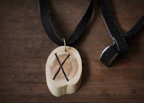 Wooden rune necklaces bearing the viking runes Dagaz, Jera, Eihwaz, Ehwaz, Nauthiz, Uruz and Gebo.Th